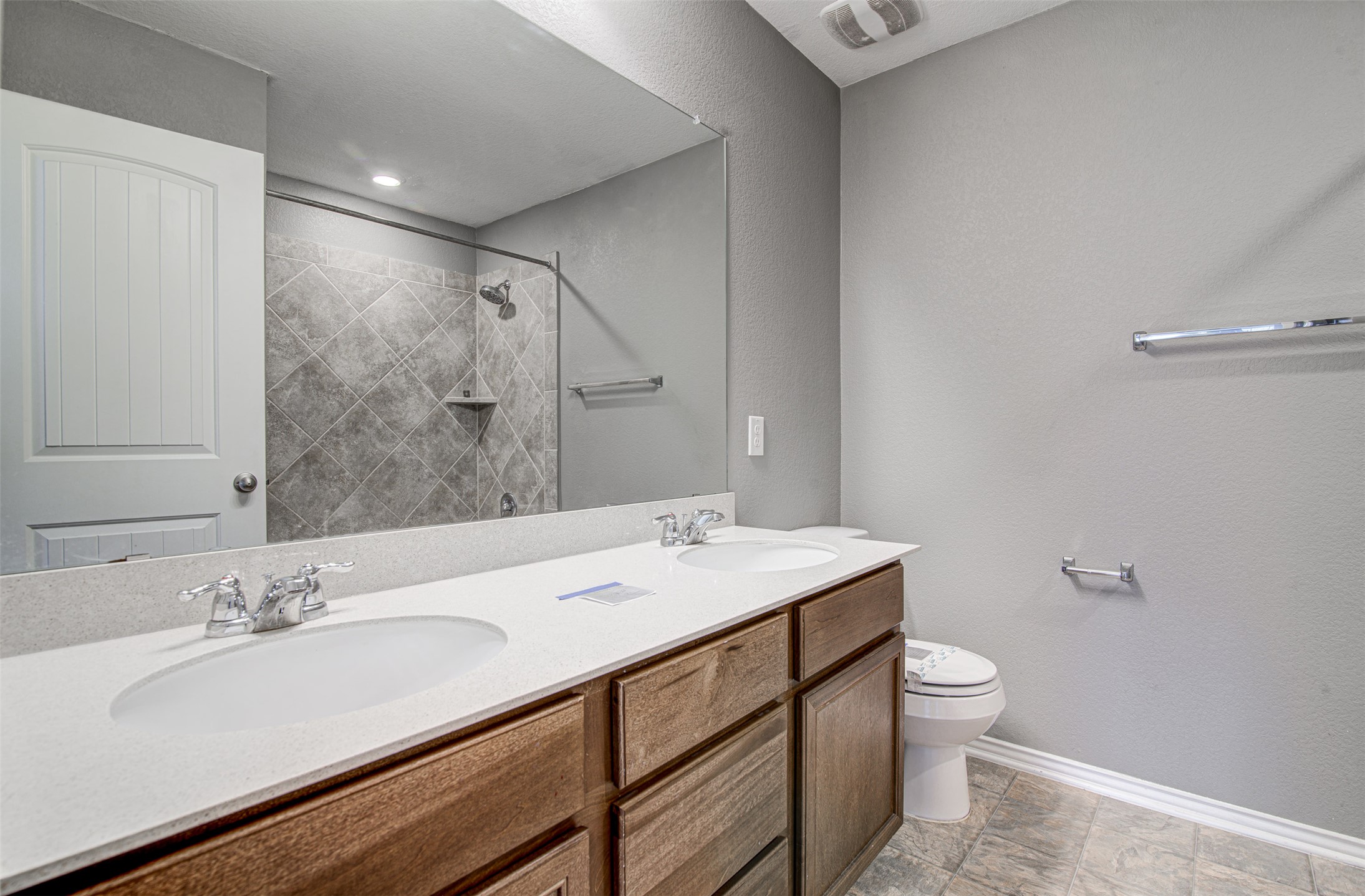 1916 Dragonfly Loop Bastrop, TX 78602 - Photo 23 of 33 a bathroom with a sink toilet and a mirror