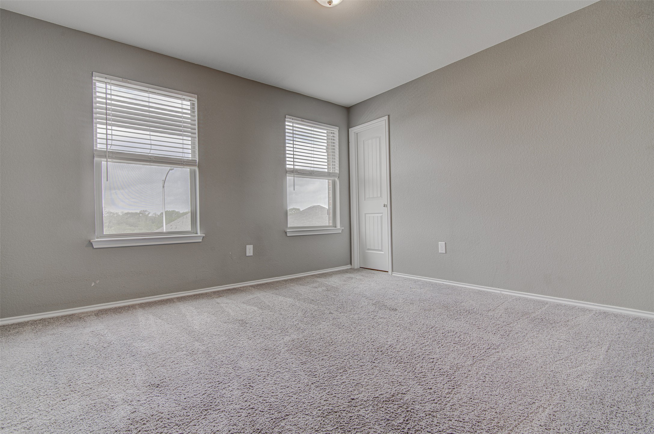 1916 Dragonfly Loop Bastrop, TX 78602 - Photo 25 of 33 an empty room with windows