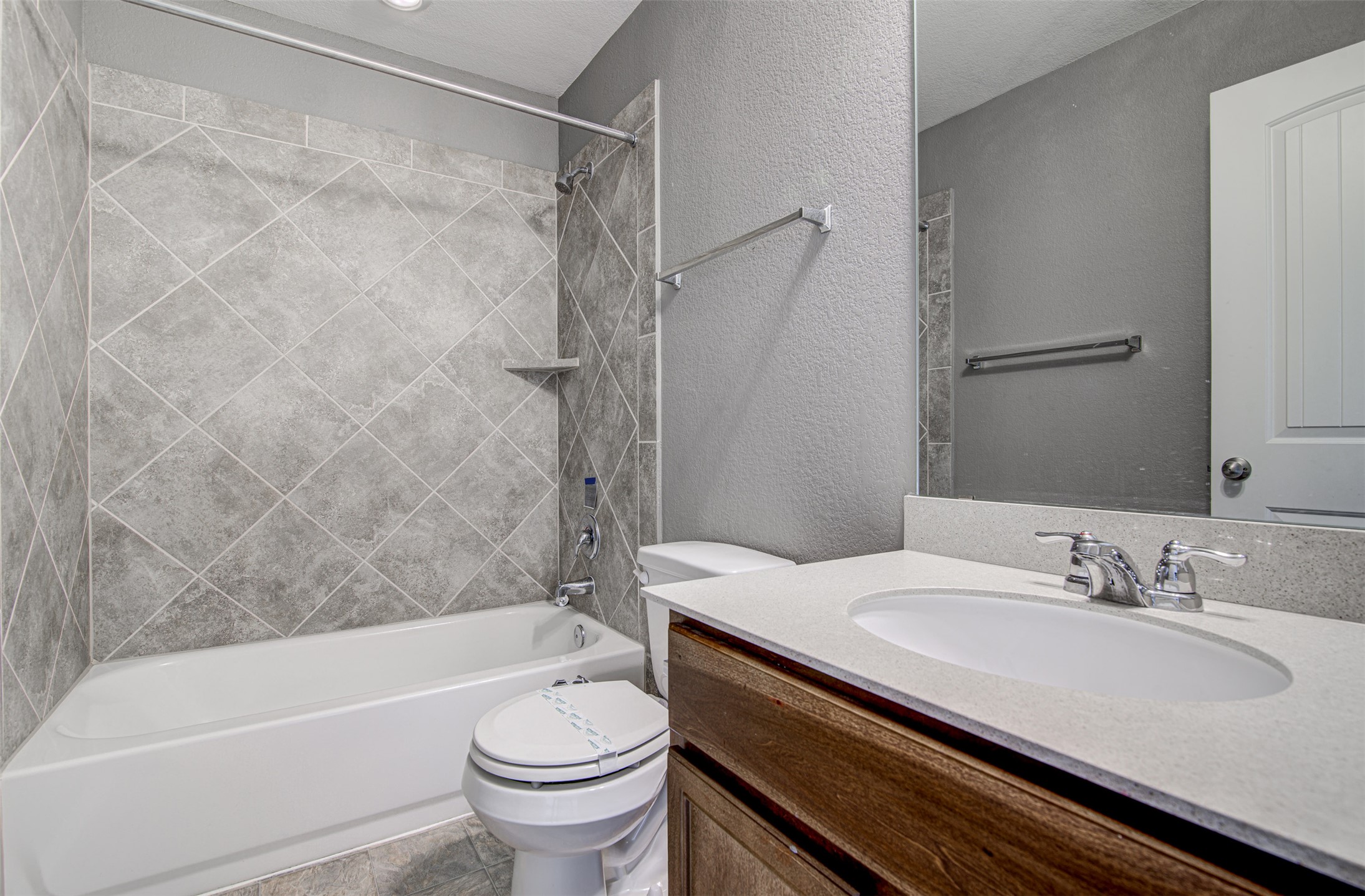 1916 Dragonfly Loop Bastrop, TX 78602 - Photo 26 of 33 a bathroom with a sink a toilet and a bathtub