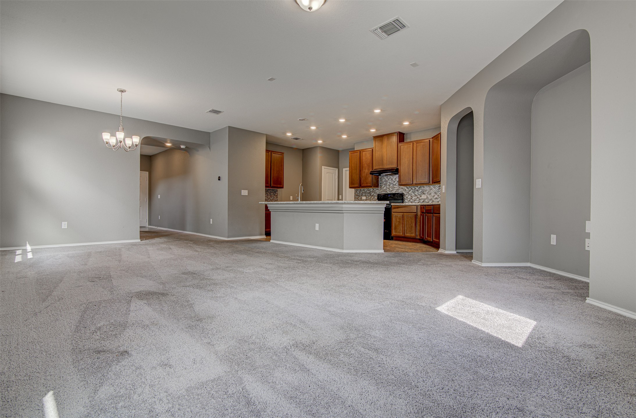 1916 Dragonfly Loop Bastrop, TX 78602 - Photo 6 of 33 a view of a kitchen with a sink and cabinets