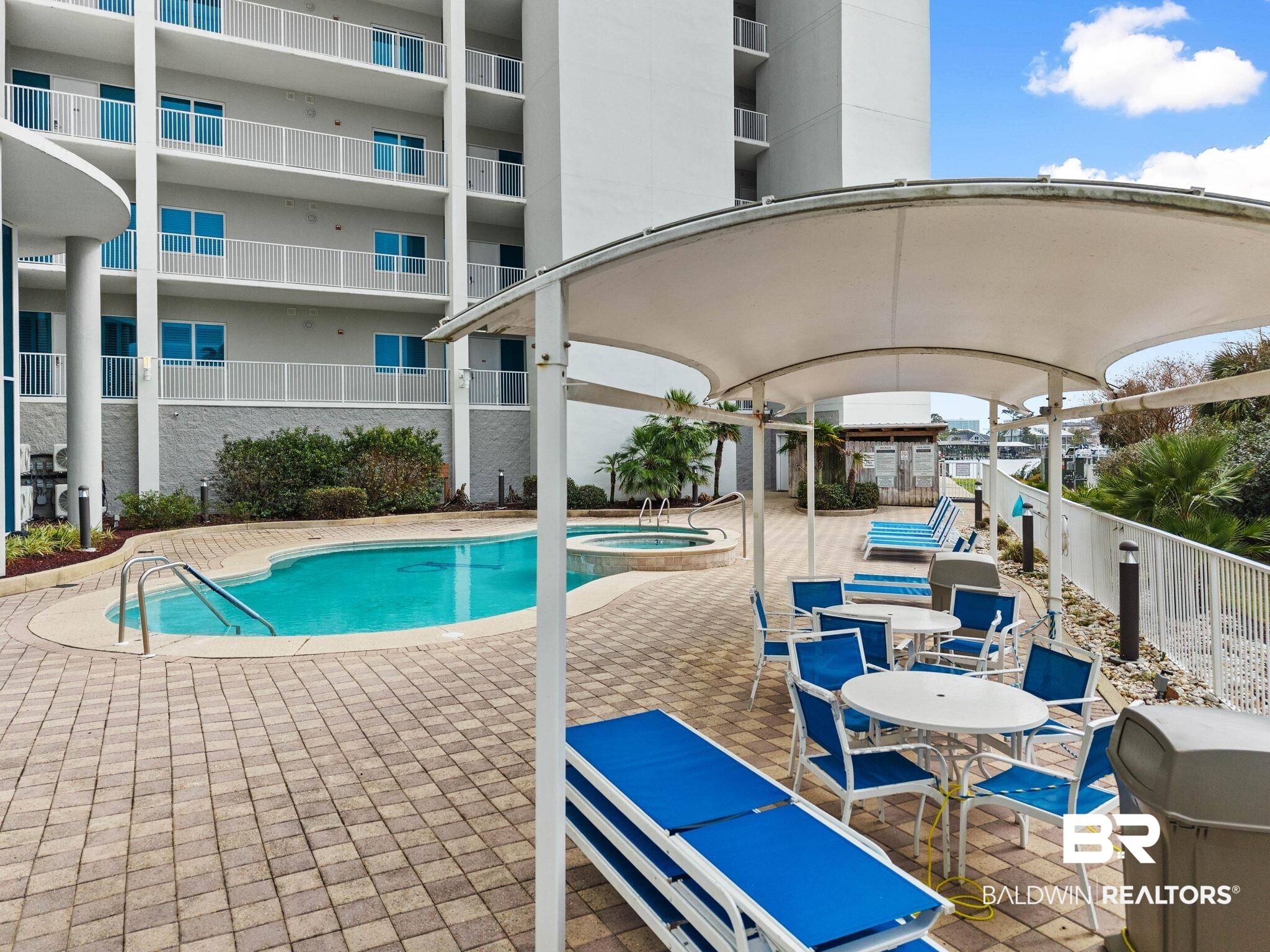 28250 Canal Road, Unit 208 Orange Beach, AL 36561 - Photo 49 of 53 Integrated pool / spa with a patio area and a grill