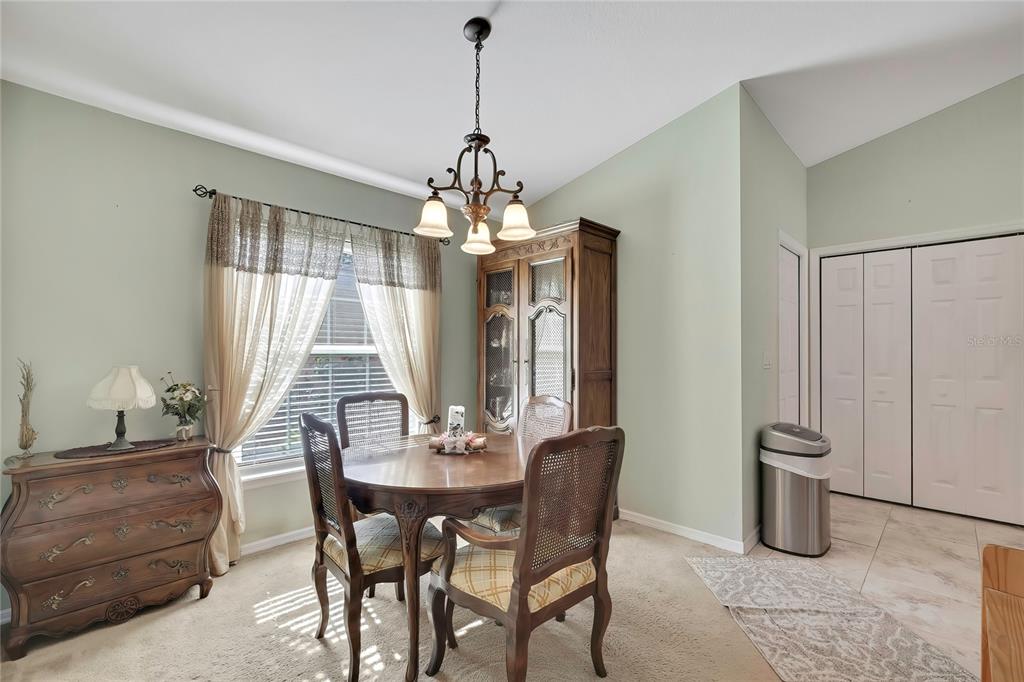 15157 Duck Hawk Road Weeki Wachee, FL 34614 - Photo 13 of 48 a dining room with furniture and window