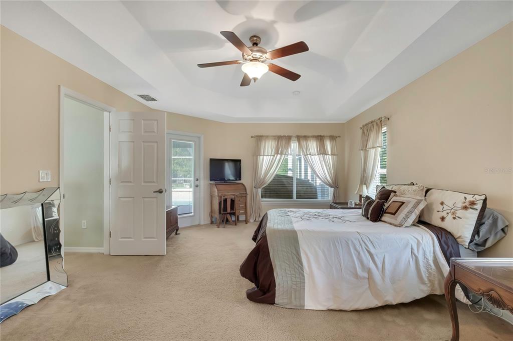 15157 Duck Hawk Road Weeki Wachee, FL 34614 - Photo 17 of 48 a bedroom with a bed and ceiling fan