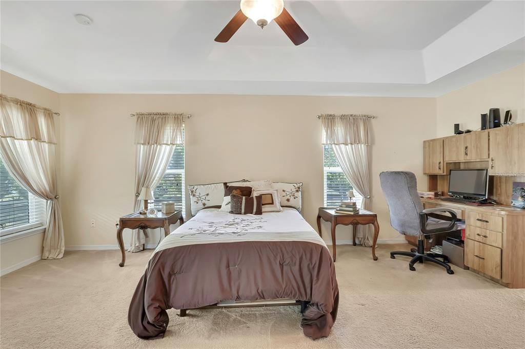 15157 Duck Hawk Road Weeki Wachee, FL 34614 - Photo 18 of 48 a bed room with a bed and a chair