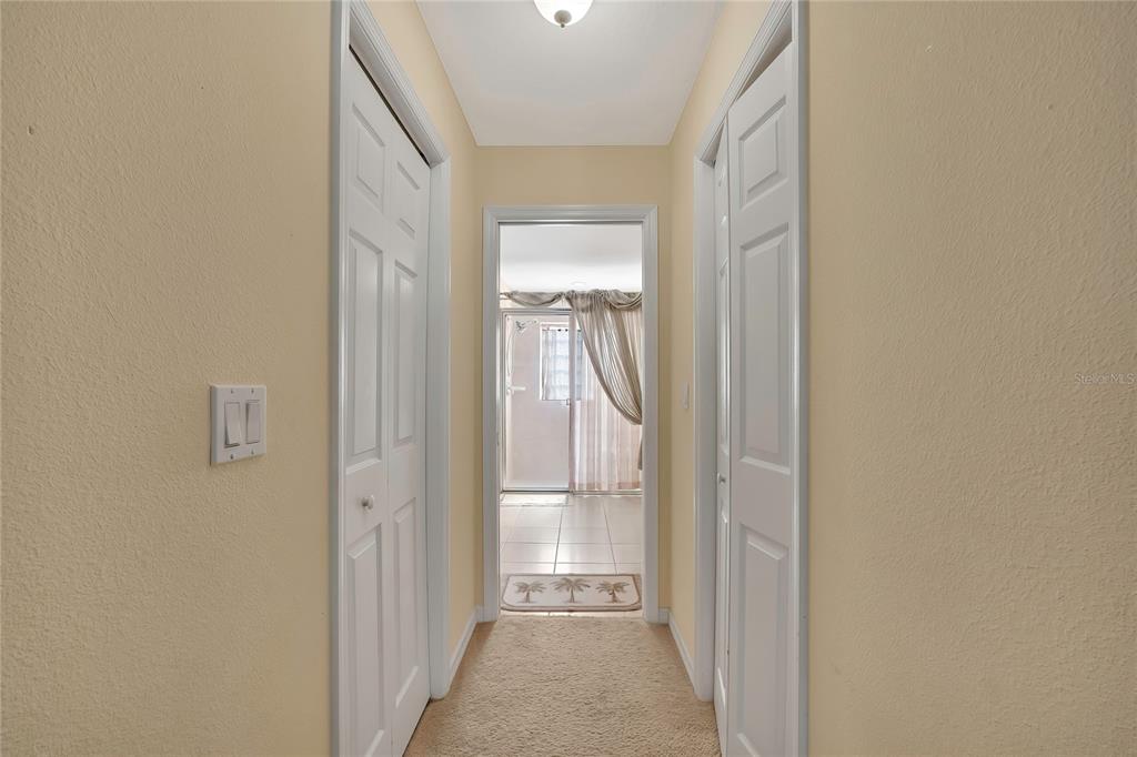 15157 Duck Hawk Road Weeki Wachee, FL 34614 - Photo 24 of 48 a view of a hallway with a glass door and a window