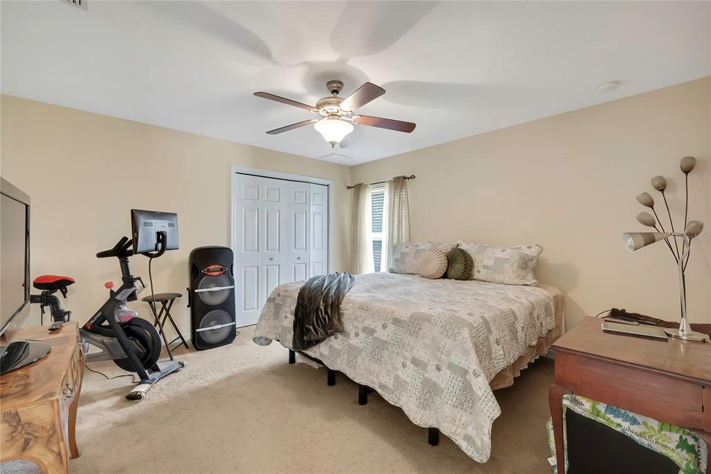 15157 Duck Hawk Road Weeki Wachee, FL 34614 - Photo 27 of 48 a bedroom with a bed a desk and with a window