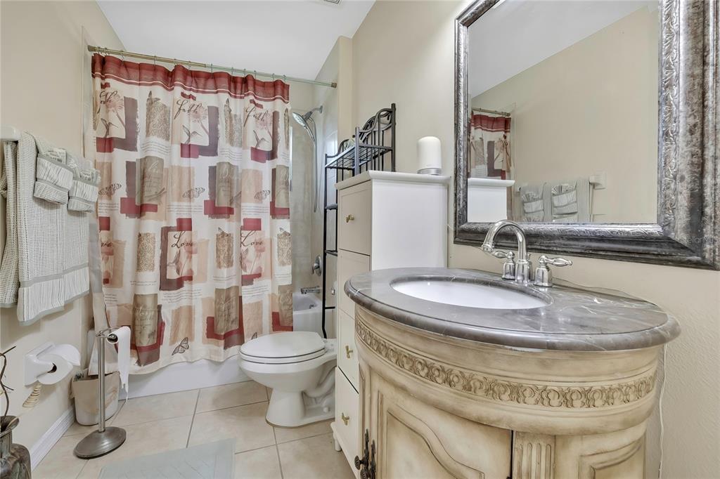 15157 Duck Hawk Road Weeki Wachee, FL 34614 - Photo 29 of 48 a bathroom with a sink toilet and shower