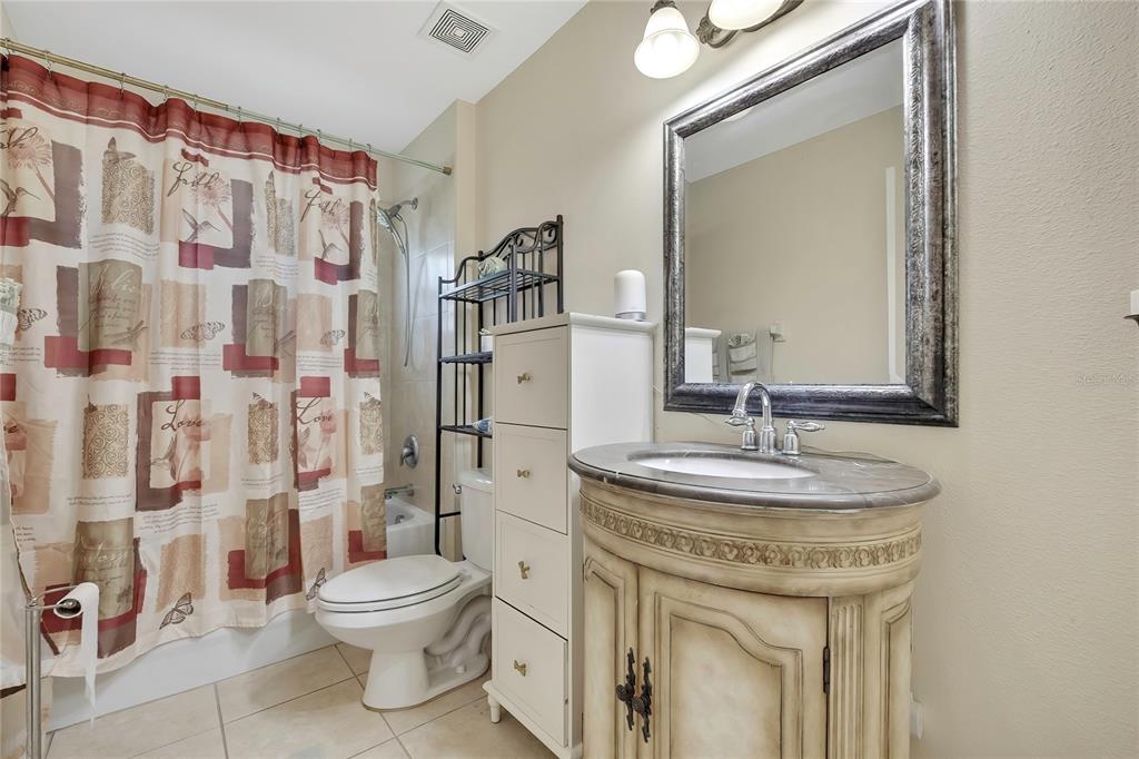 15157 Duck Hawk Road Weeki Wachee, FL 34614 - Photo 30 of 48 a bathroom with a sink toilet and shower