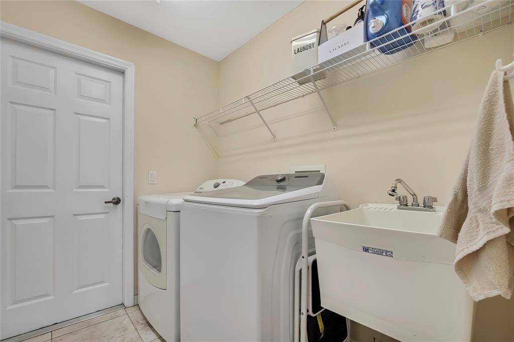15157 Duck Hawk Road Weeki Wachee, FL 34614 - Photo 31 of 48 a utility room with dryer and washer