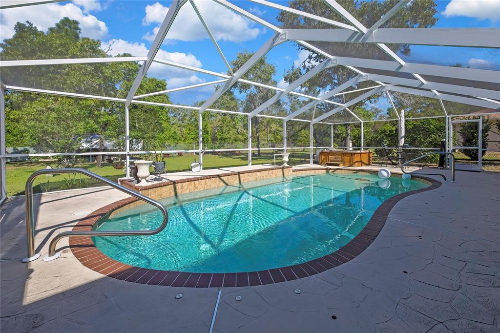 15157 Duck Hawk Road Weeki Wachee, FL 34614 - Photo 33 of 48 a view of a swimming pool with a patio