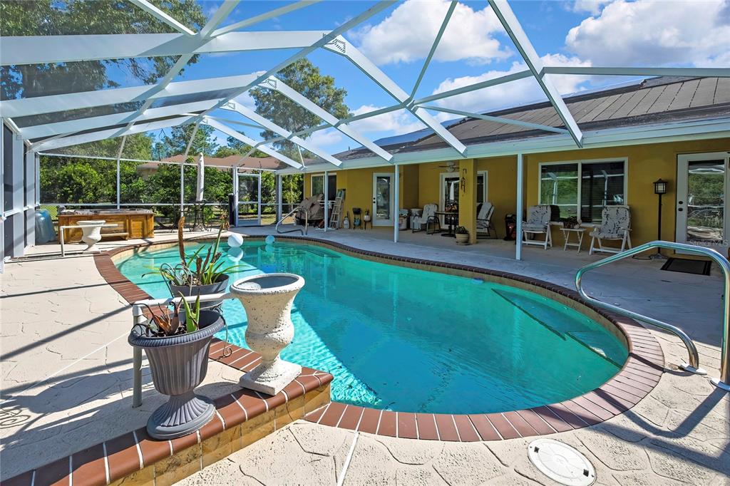 15157 Duck Hawk Road Weeki Wachee, FL 34614 - Photo 35 of 48 a view of a swimming pool with a patio