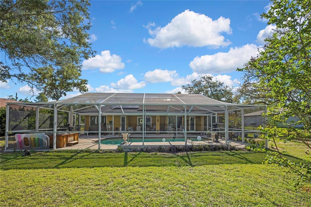 15157 Duck Hawk Road Weeki Wachee, FL 34614 - Photo 41 of 48 a view of a house with a swimming pool