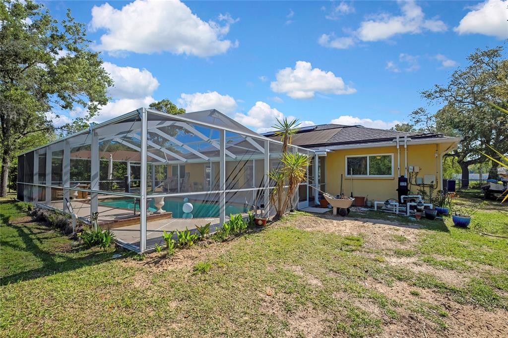 15157 Duck Hawk Road Weeki Wachee, FL 34614 - Photo 42 of 48 a view of a house with backyard and sitting area