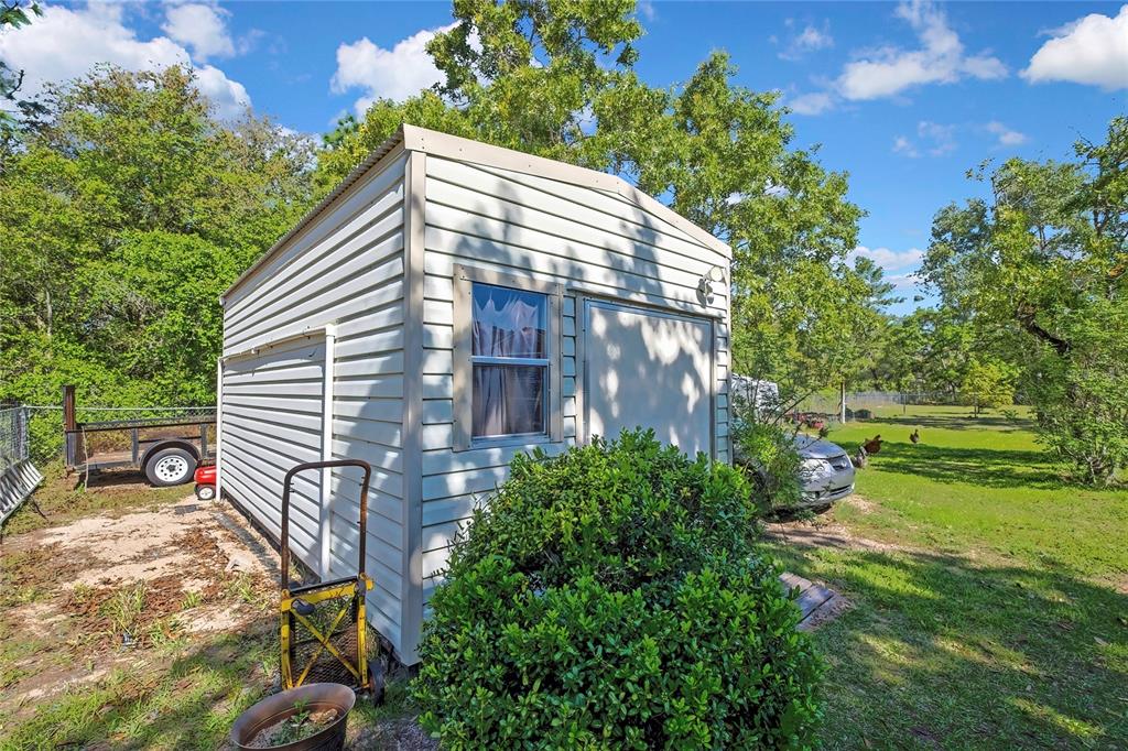15157 Duck Hawk Road Weeki Wachee, FL 34614 - Photo 45 of 48 a view of a house with a yard