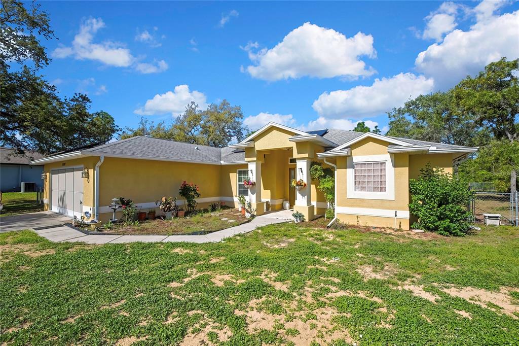 15157 Duck Hawk Road Weeki Wachee, FL 34614 - Photo 46 of 48 a front view of house with yard patio and fire pit
