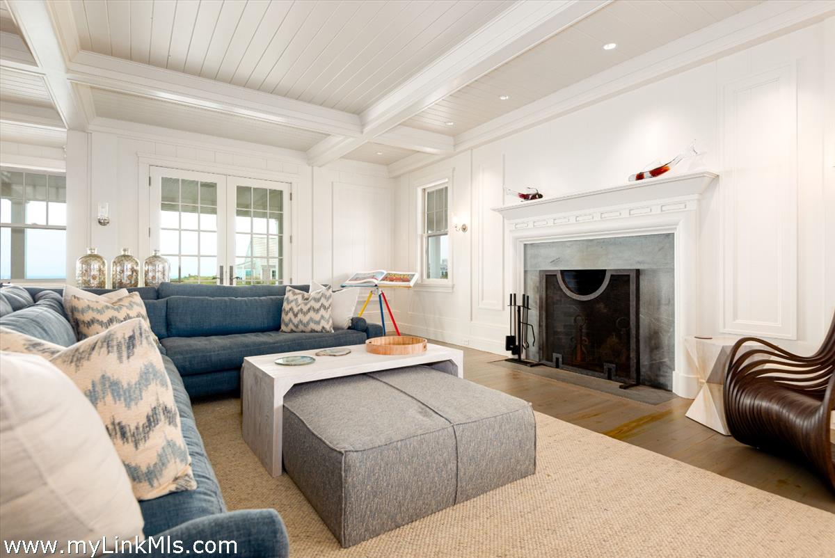37 Sankaty Head Road Nantucket, MA 02554 - Photo 23 of 65 a living room with furniture and a fireplace