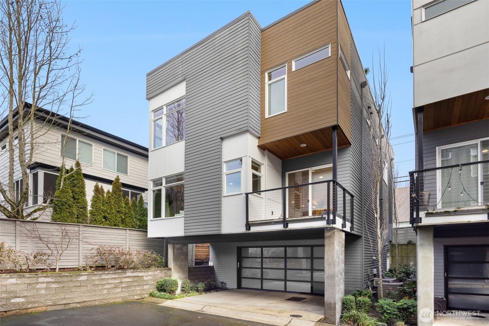 a front view of a house with a garage