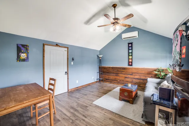 a living room with furniture and a table
