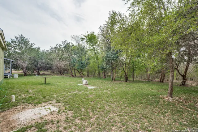 a backyard of a house with lots of green space