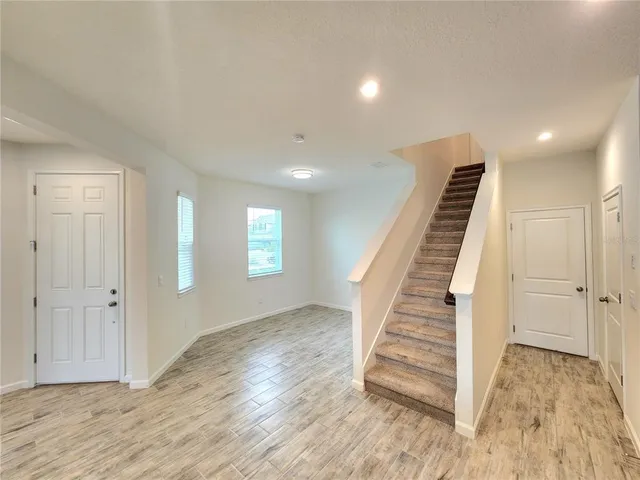 a view of entryway with wooden floor