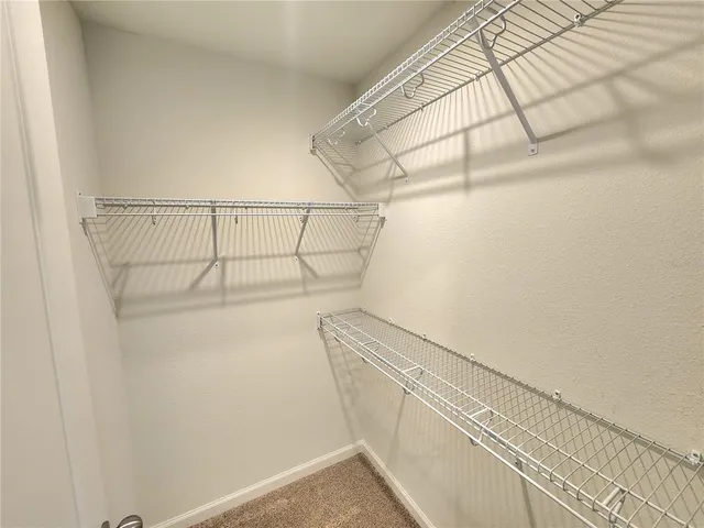 a view of a room with racks on the wall