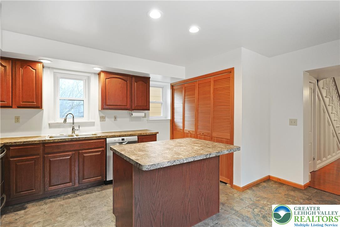 337 West Main Street Bath, PA 18014 - Photo 13 of 32 a kitchen with a sink stove and cabinets