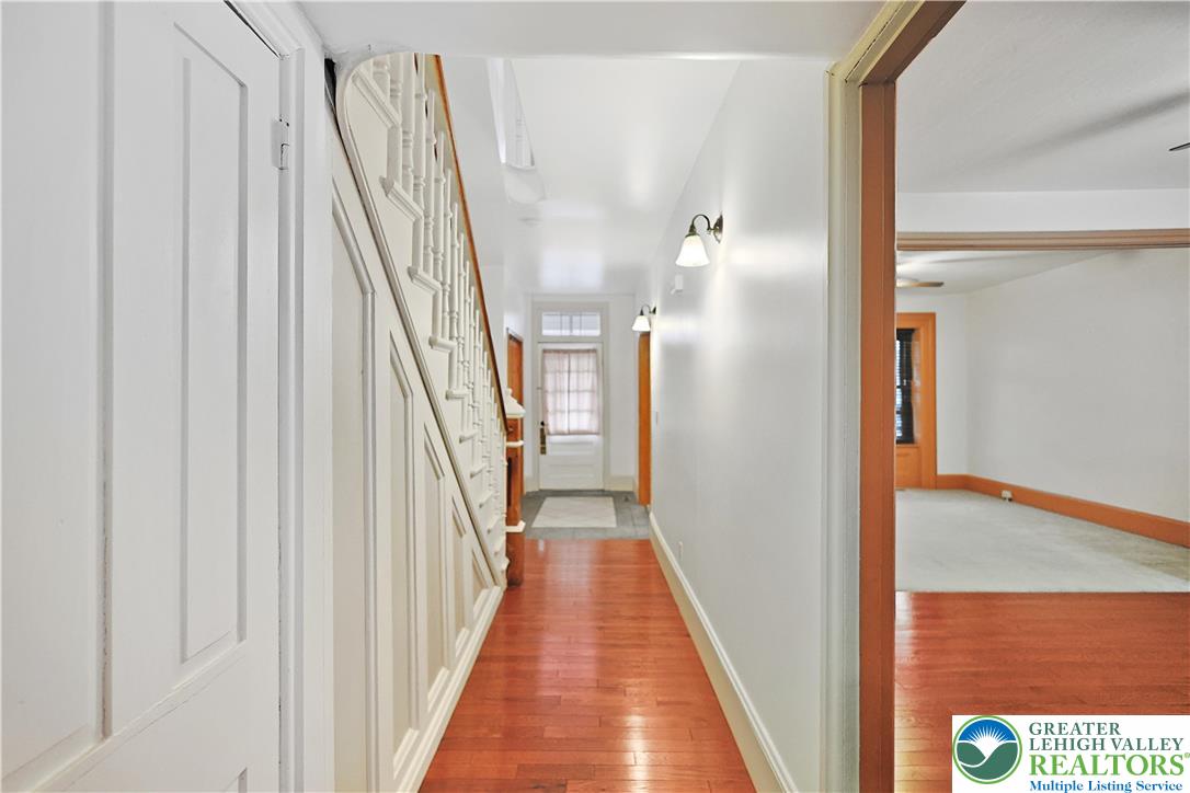 337 West Main Street Bath, PA 18014 - Photo 14 of 32 a view of a hallway with wooden floor and staircase