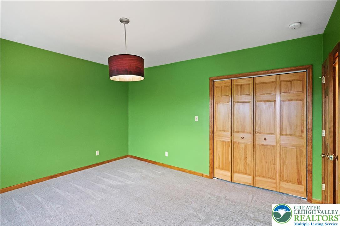 337 West Main Street Bath, PA 18014 - Photo 22 of 32 a view of a room with green walls and a chair