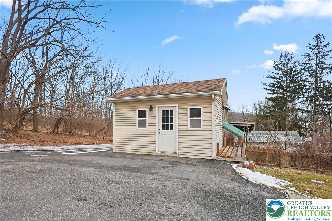 337 West Main Street Bath, PA 18014 - Photo 31 of 32 a view of a house with a yard and garage