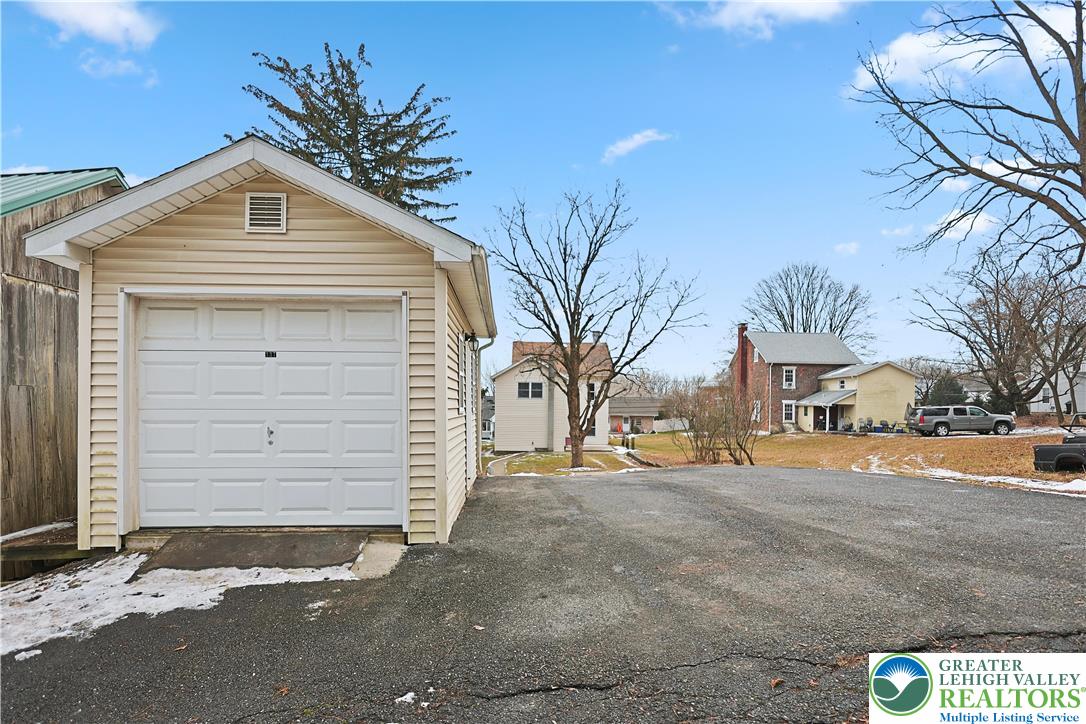 337 West Main Street Bath, PA 18014 - Photo 32 of 32 a front view of a house with a yard and garage