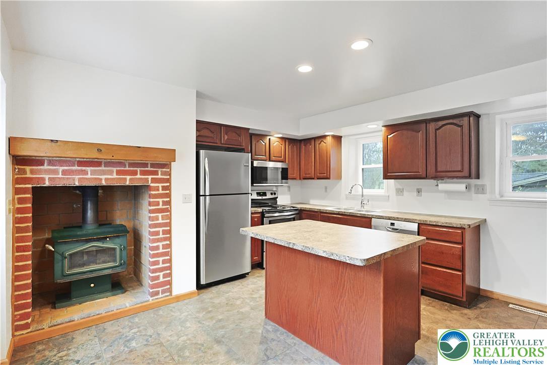337 West Main Street Bath, PA 18014 - Photo 8 of 32 a kitchen with stainless steel appliances granite countertop a refrigerator stove and sink