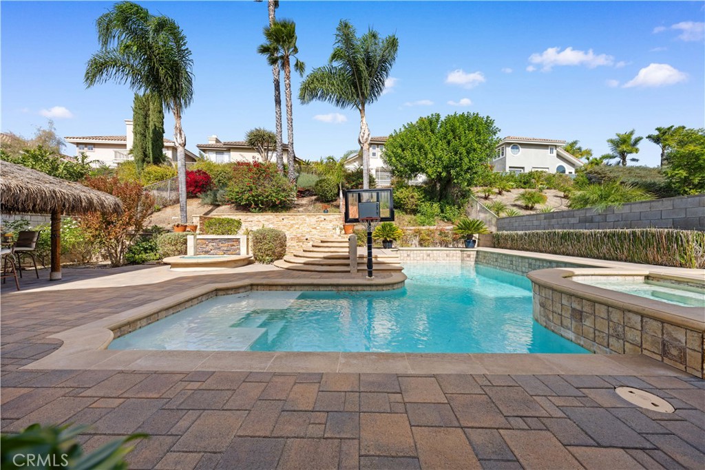 23 Yellowpine Lane Trabuco Canyon, CA 92679 - Photo 11 of 22 a view of a swimming pool and lounge chair