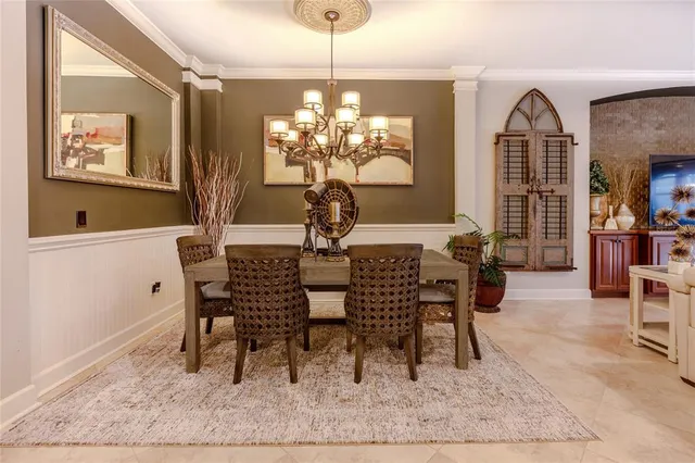 a living room with furniture a ceiling fan and a flat screen tv