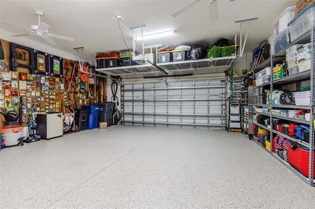 an aerial view of residential house with outdoor space and swimming pool