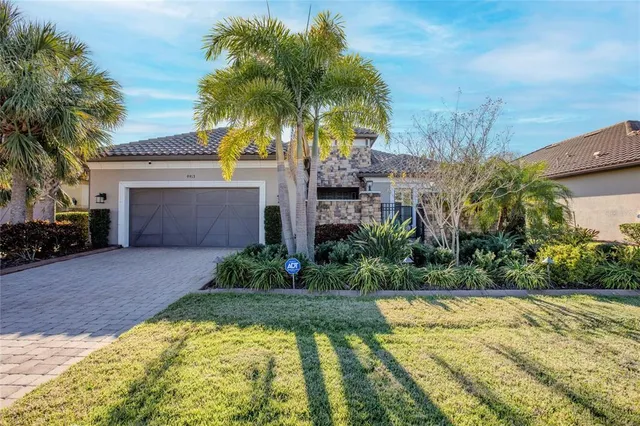 an aerial view of residential house with outdoor space and swimming pool
