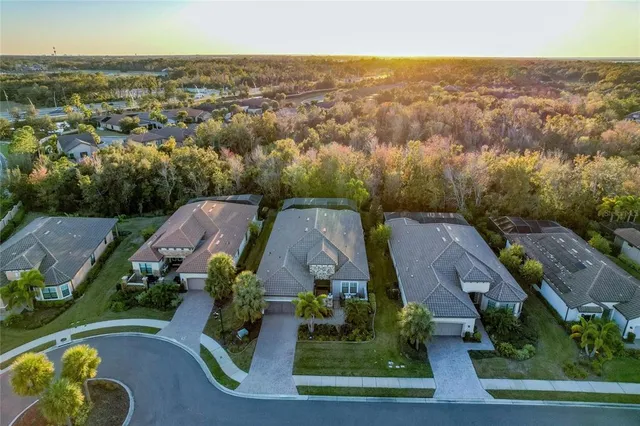 a view of a lake with a table and chairs