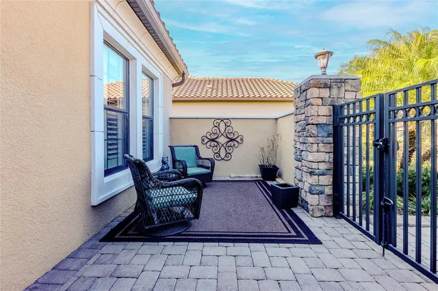 a view of a hallway with furniture and a potted plant