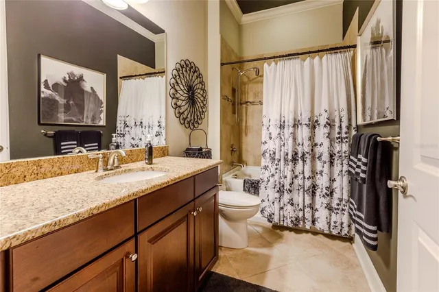 a bed room with a bed and a chandelier