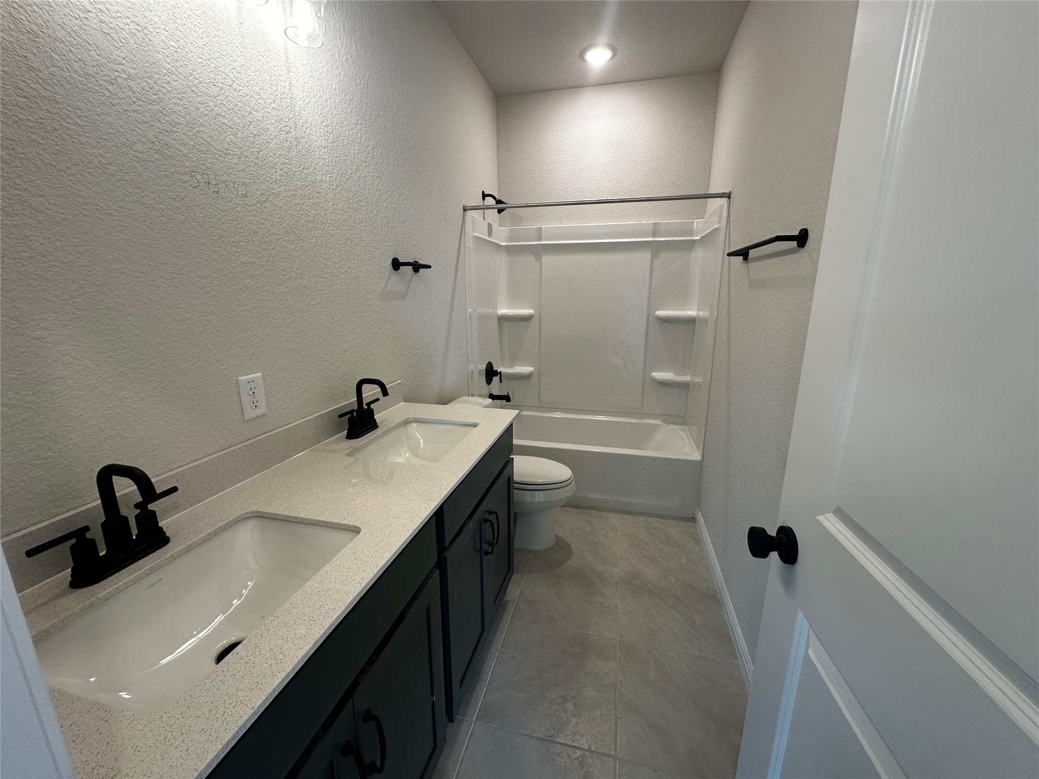 1053 Sienna Bear Road Georgetown, TX 78633 - Photo 21 of 32 a bathroom with a sink and mirror