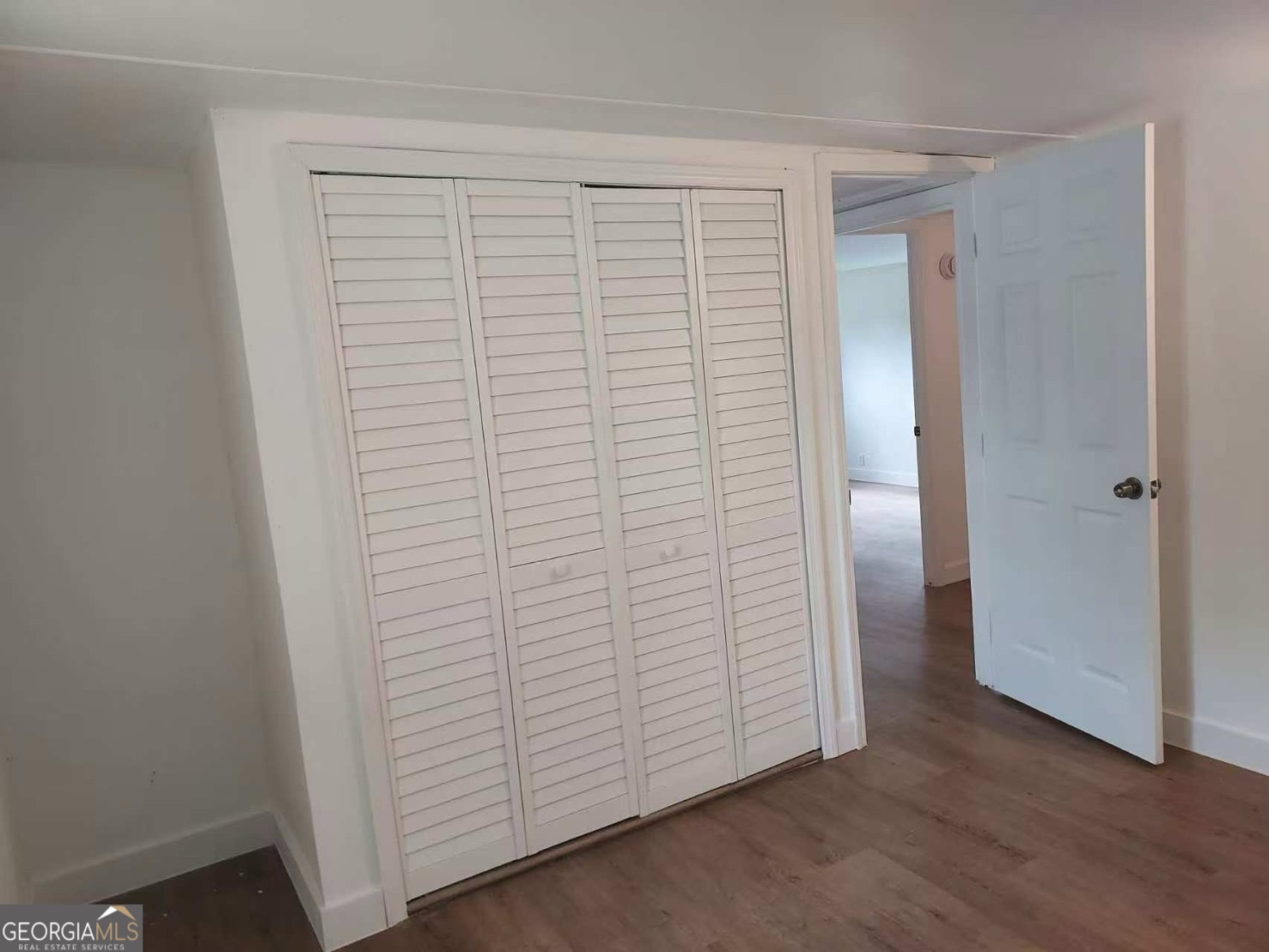 514 Phillips Road Warm Springs, GA 31830 - Photo 12 of 36 an empty room with wooden floor