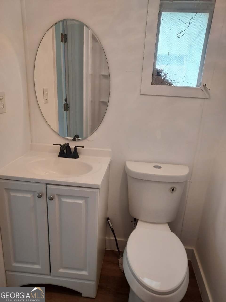 514 Phillips Road Warm Springs, GA 31830 - Photo 17 of 36 a white toilet sitting next to a bathroom sink