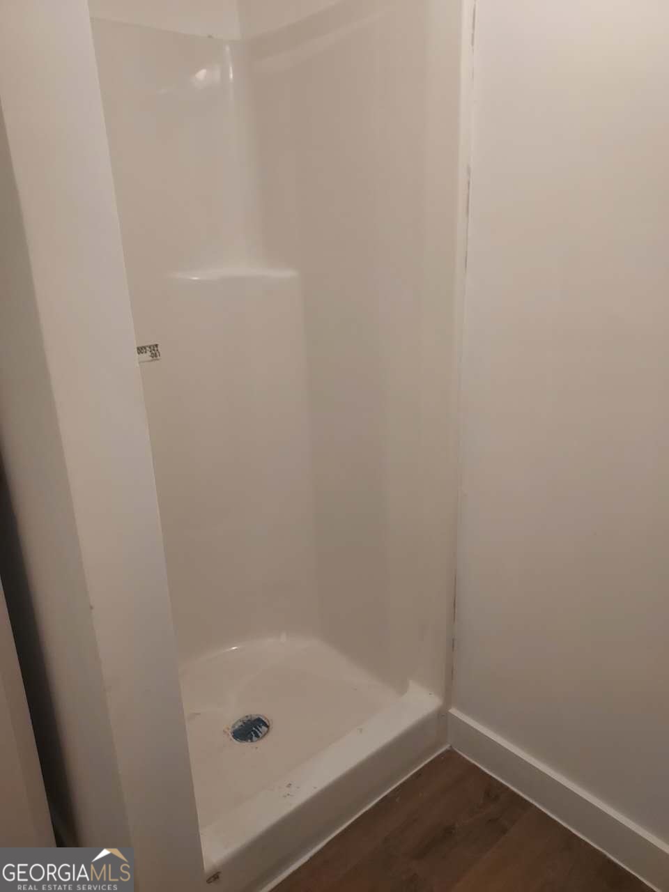 514 Phillips Road Warm Springs, GA 31830 - Photo 21 of 36 a bathroom with a glass shower door