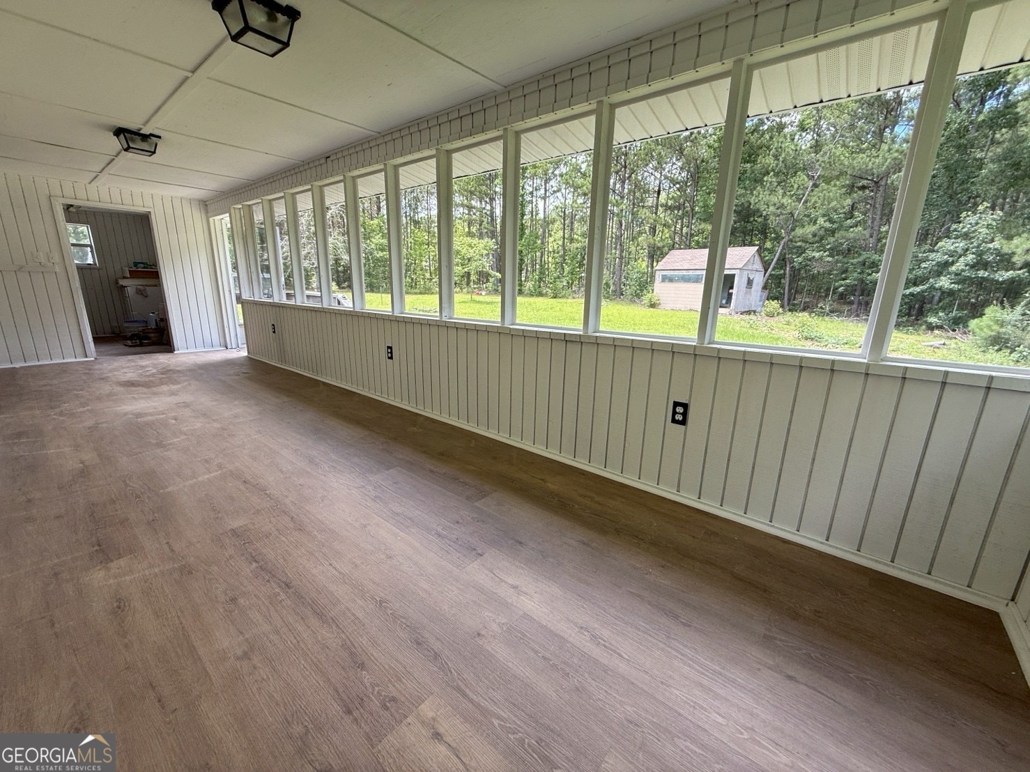 514 Phillips Road Warm Springs, GA 31830 - Photo 34 of 36 a view of an empty room with wooden floor and a window