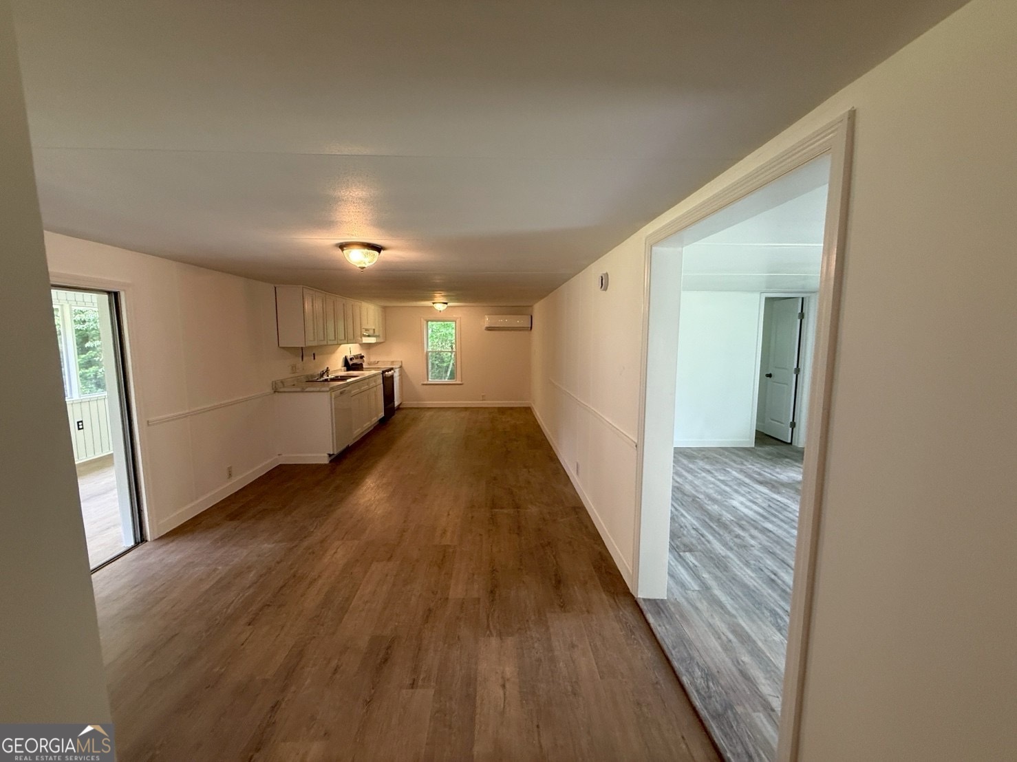514 Phillips Road Warm Springs, GA 31830 - Photo 7 of 36 a view of a hallway with wooden floor