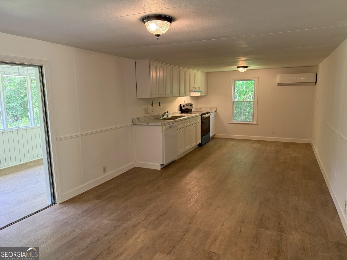 514 Phillips Road Warm Springs, GA 31830 - Photo 8 of 36 a kitchen with a sink wooden floor and a window