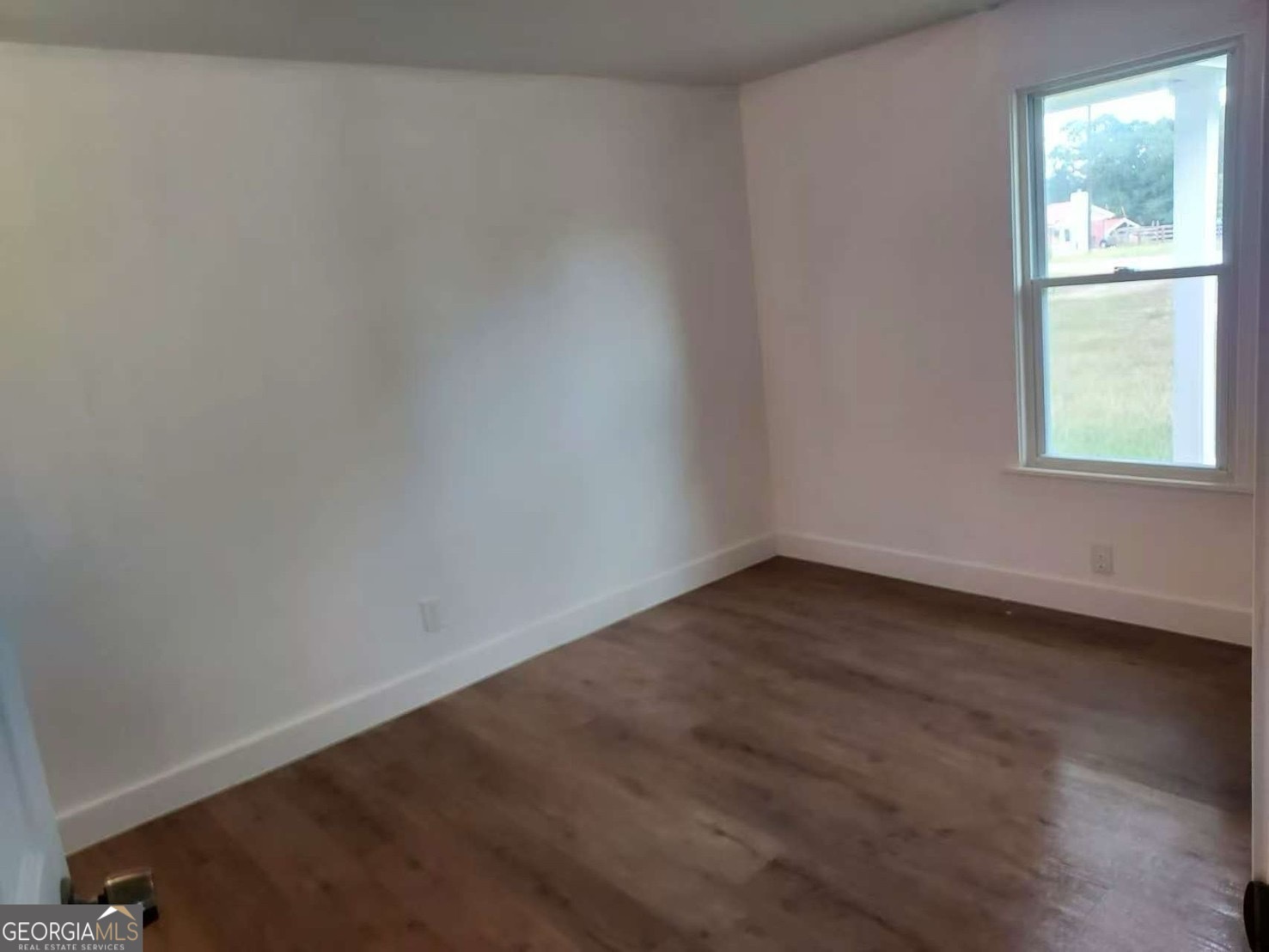 514 Phillips Road Warm Springs, GA 31830 - Photo 10 of 36 an empty room with a window