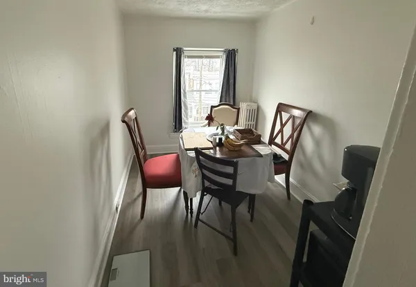a view of a workspace with furniture and a potted plant