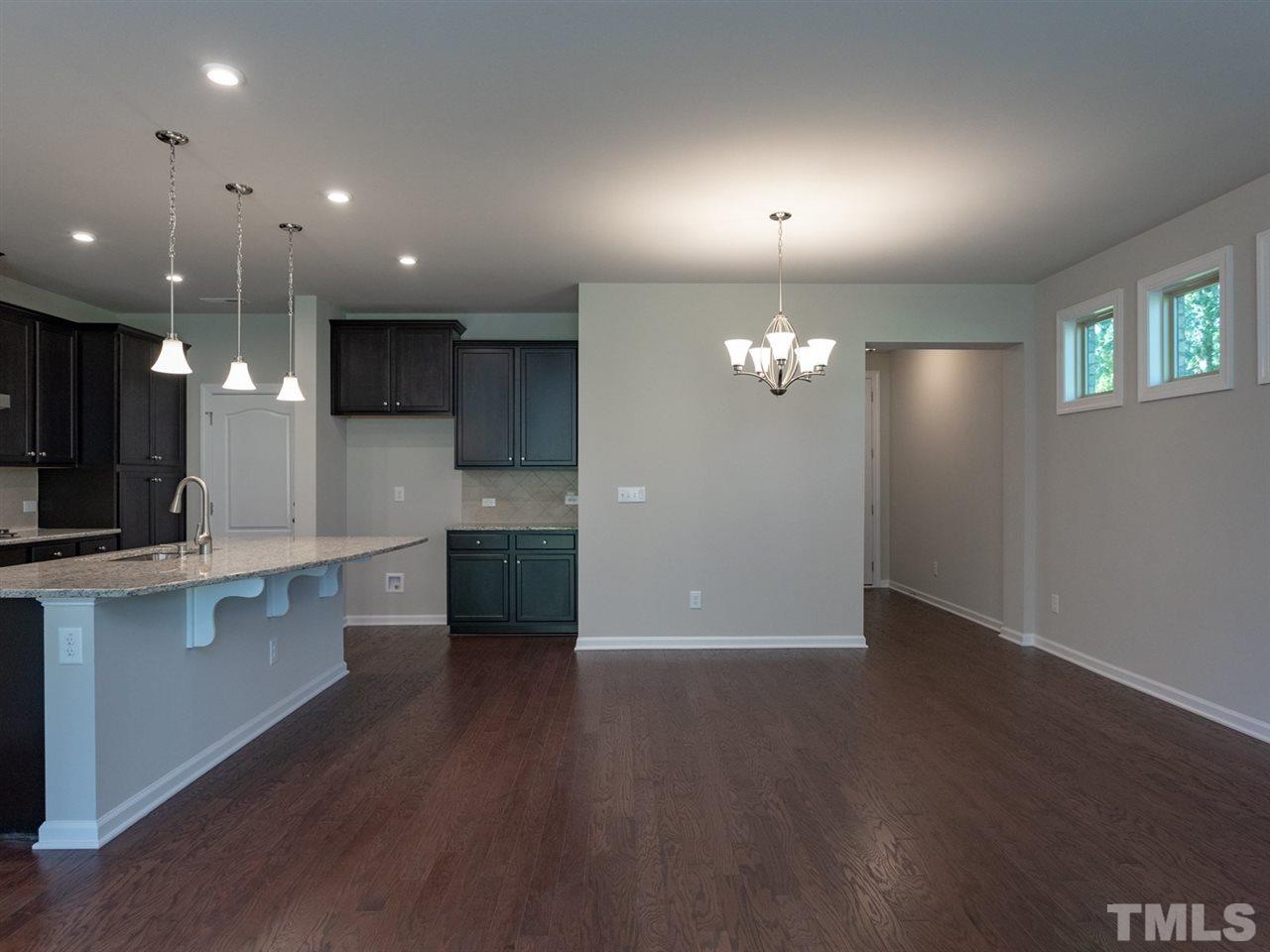 845 Rymark Court Cary, NC 27513 - Photo 9 of 21 a view of a kitchen with a sink wooden cabinets and appliances