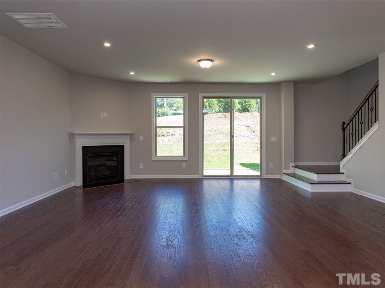 845 Rymark Court Cary, NC 27513 - Photo 10 of 21 a view of an empty room with wooden floor and a window