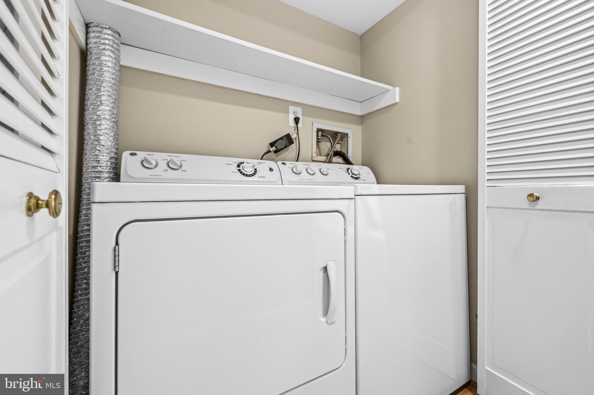 2116 Green Watch Way, Unit 200D Reston, VA 20191 - Photo 21 of 38 a utility room with dryer and washer